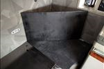 Behind each seat will be a triangle-shaped storage area.
